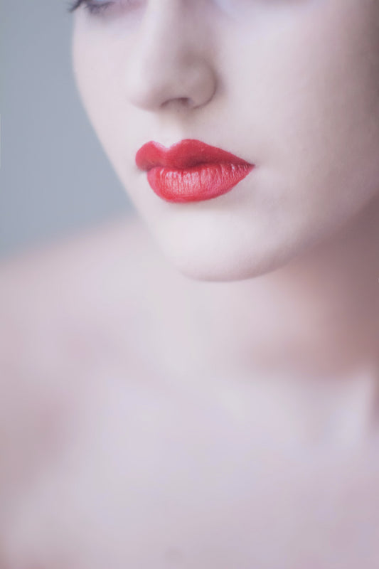 a lady with beautiful red lips - blog cover for The Ultimate Guide to Finding the Best Lip Balm for Dry Lips