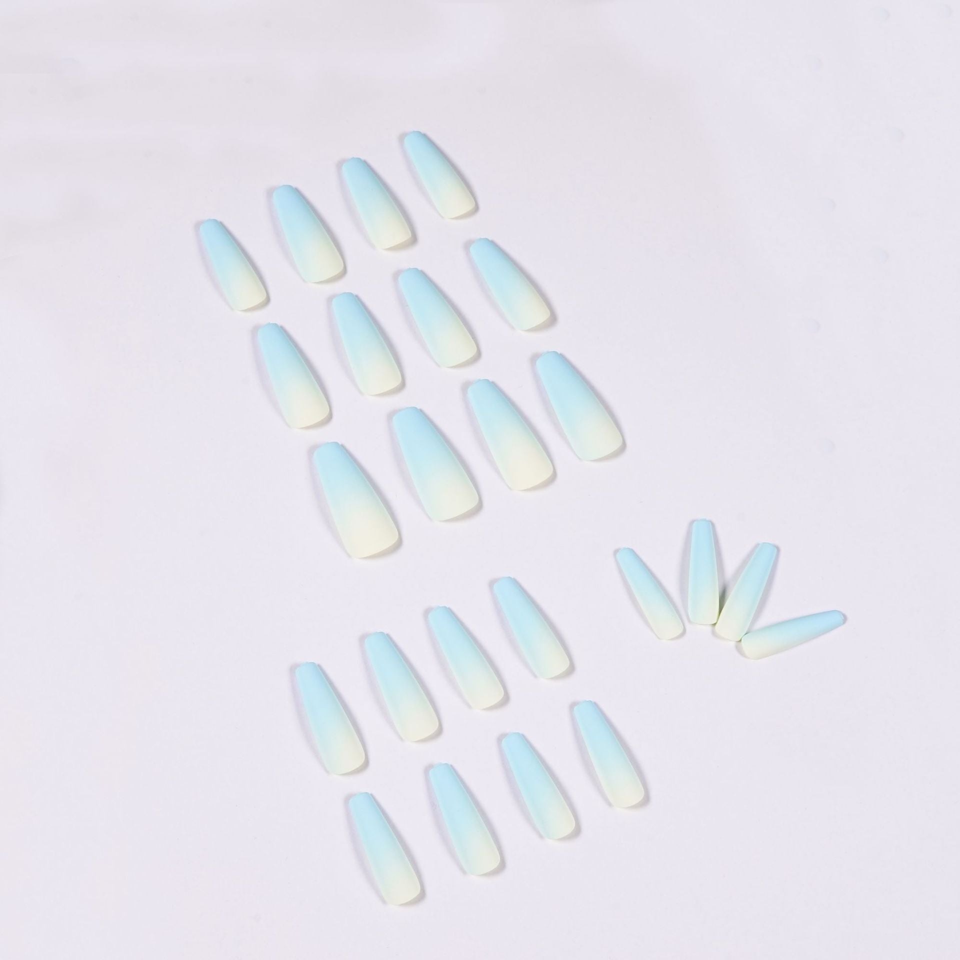blue ombre nails 70305300-1 lying on white background