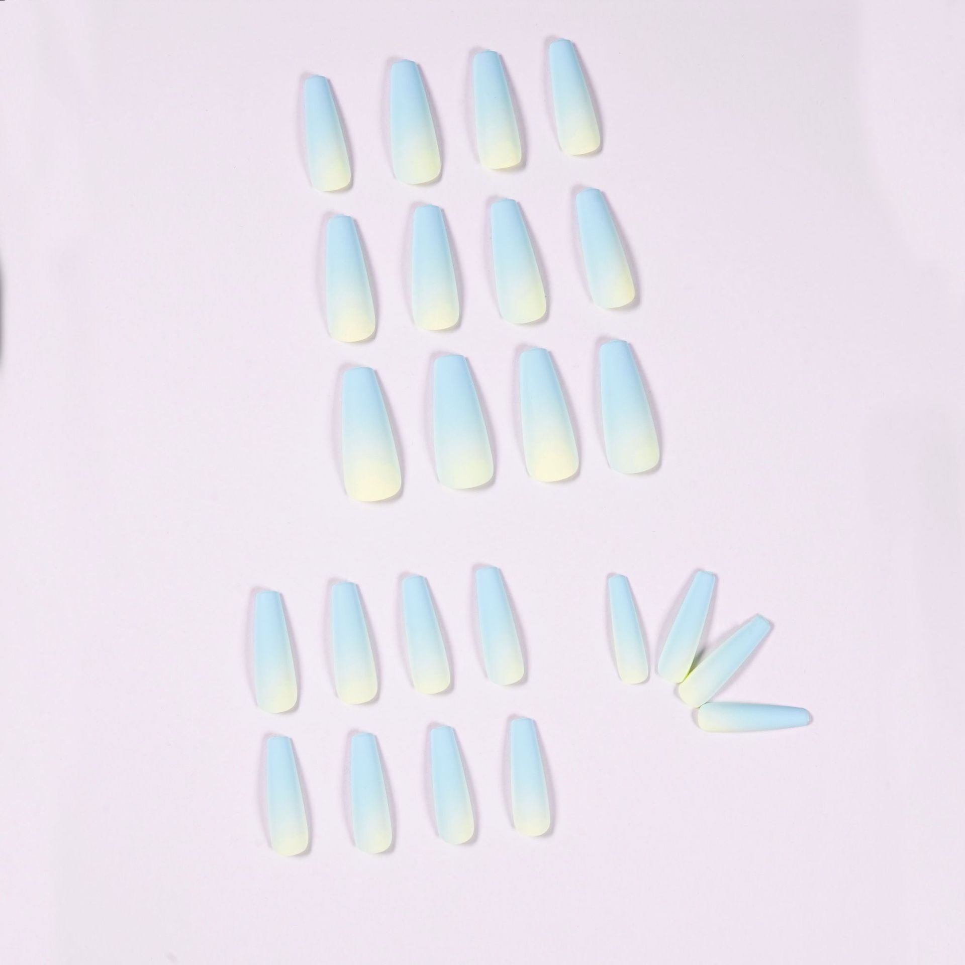 blue ombre nails 70305300 lying on white background